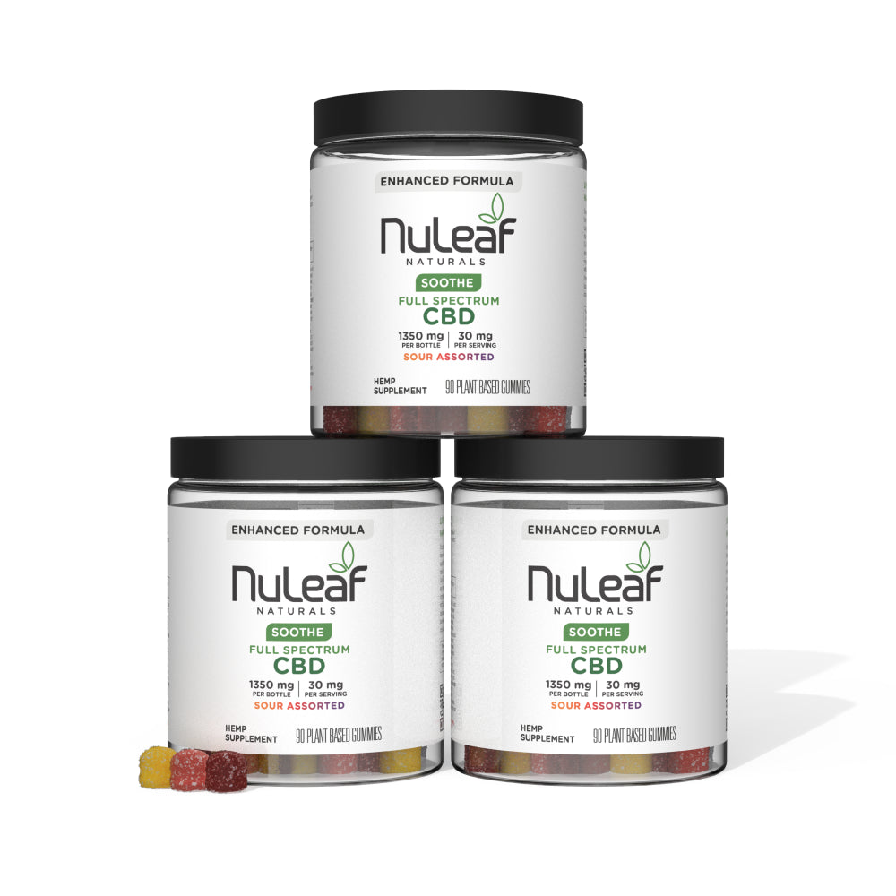 Three jars of NuLeaf Naturals Soothe Full Spectrum CBD gummies, sour assorted flavor, stacked together with white labels and black lids.