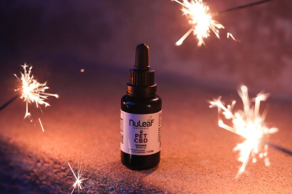 bottle of cbd oil with sparklers