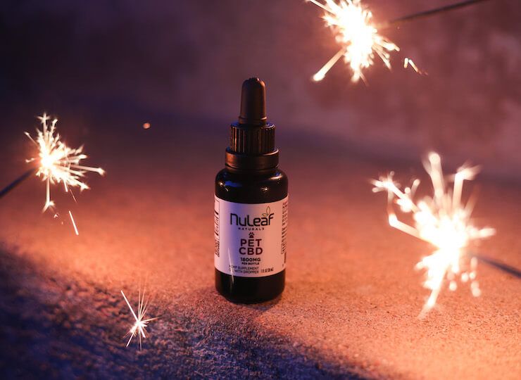 bottle of cbd oil with sparklers